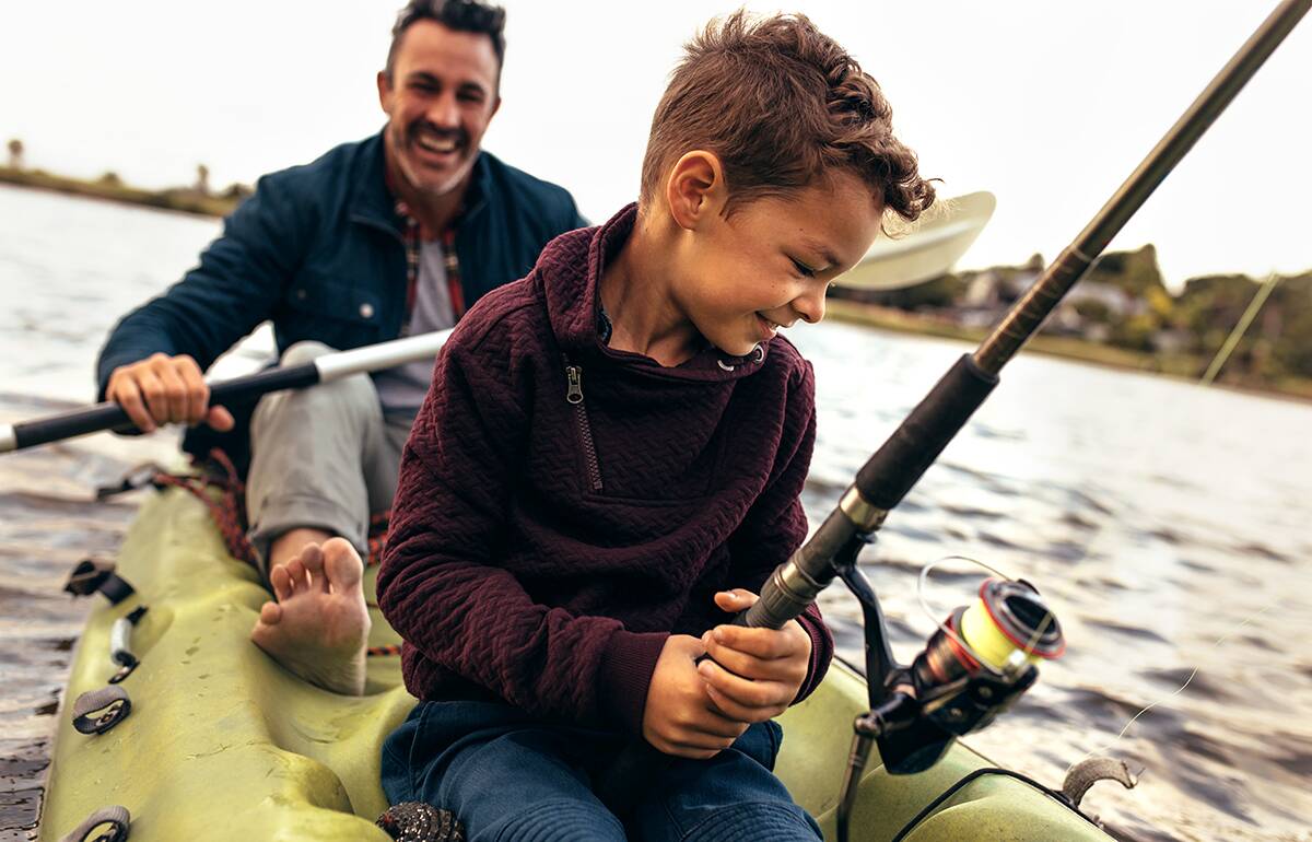 Father and son in boat fishing